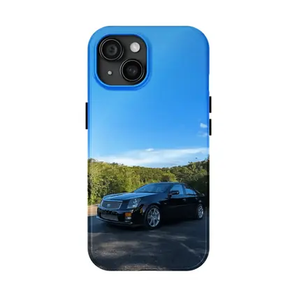 Black Cadillac CTS Parked Against Blue Sky