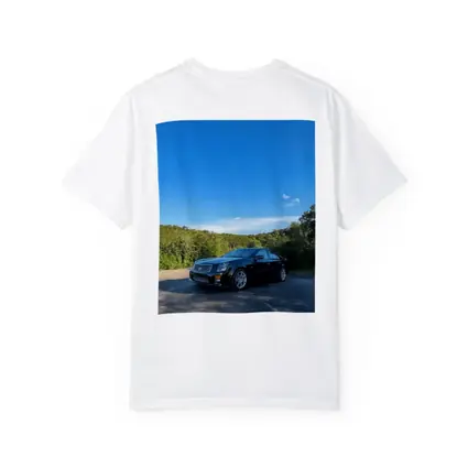 Black Cadillac CTS Parked Against Blue Sky