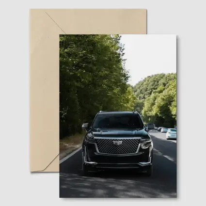 Black Cadillac Escalade On Forest Road