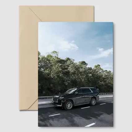 Black Cadillac Escalade SUV On Highway