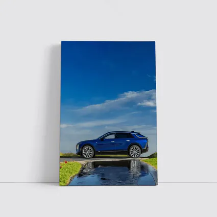 Cadillac Lyriq Blue SUV Cloudy Sky