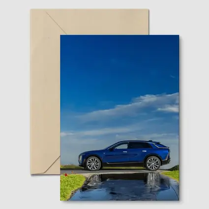 Cadillac Lyriq Blue SUV Cloudy Sky