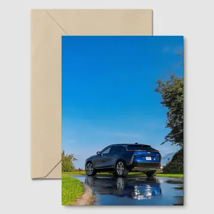 Cadillac IQ Blue SUV Wet Road