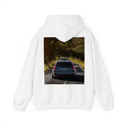 Cadillac CTS Wagon Driving Through Forest Road