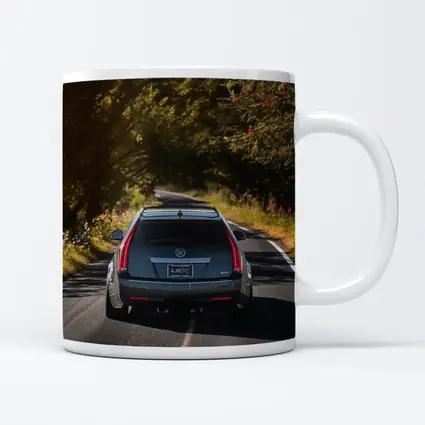 Cadillac CTS Wagon Driving Through Forest Road