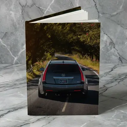 Cadillac CTS Wagon Driving Through Forest Road