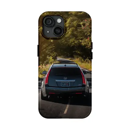 Cadillac CTS Wagon Driving Through Forest Road