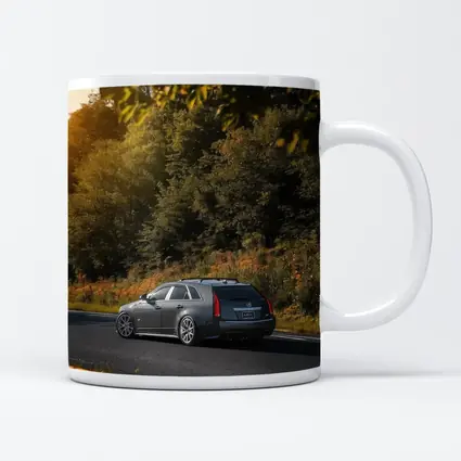 Cadillac CTS Wagon Rolling Through Forest Road