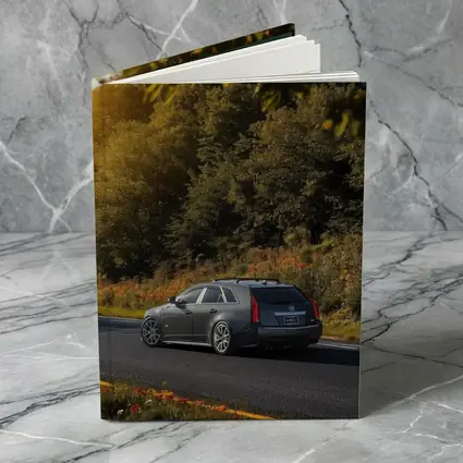 Cadillac CTS Wagon Rolling Through Forest Road