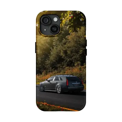 Cadillac CTS Wagon Rolling Through Forest Road