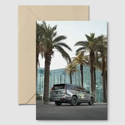 Cadillac Escalade Gray Under Palm Trees