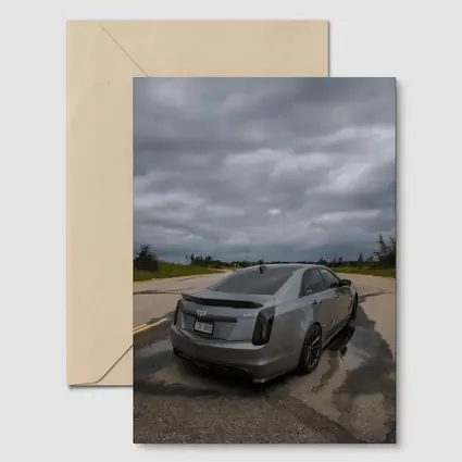 Cadillac CTS Sedan Gray Stormy Road