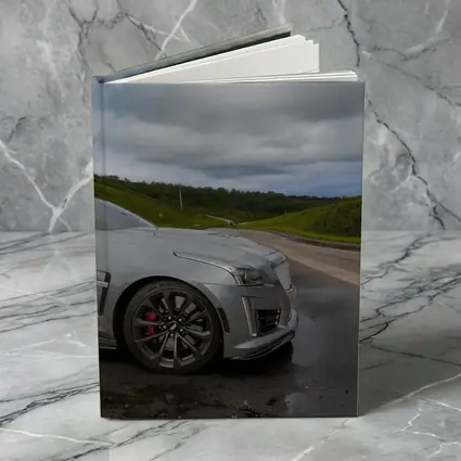 Cadillac CTS Silver Sedan Wet Road