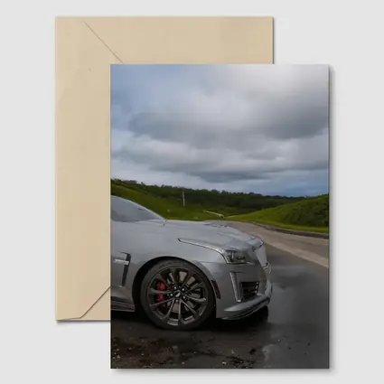Cadillac CTS Silver Sedan Wet Road