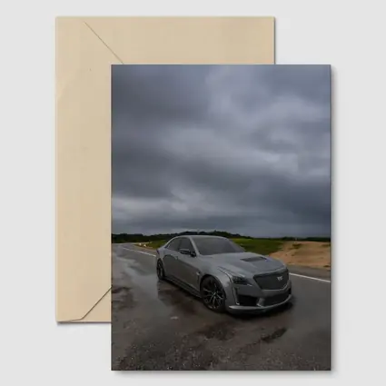 Cadillac CTS Gray Sedan Stormy Road