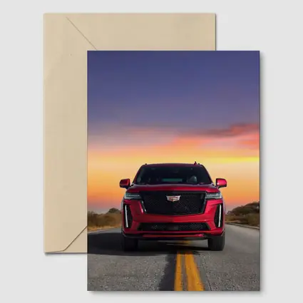 Red Cadillac Escalade SUV Sunset Road