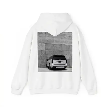 White Cadillac Escalade Against Concrete Wall
