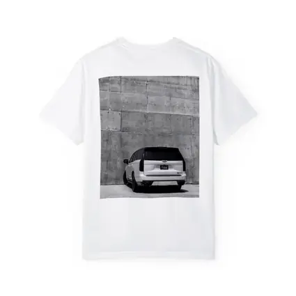 White Cadillac Escalade Against Concrete Wall