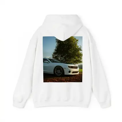 White Chevrolet Camaro Parked Near Green Tree