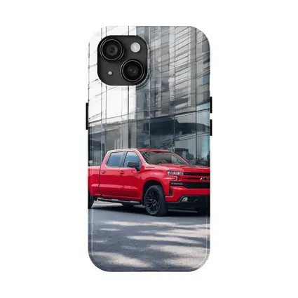 Red Chevrolet Silverado Parked by Glass Building
