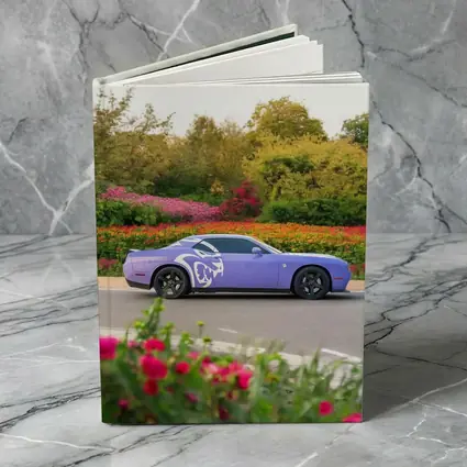 Purple Dodge Challenger Parked Near Flowers
