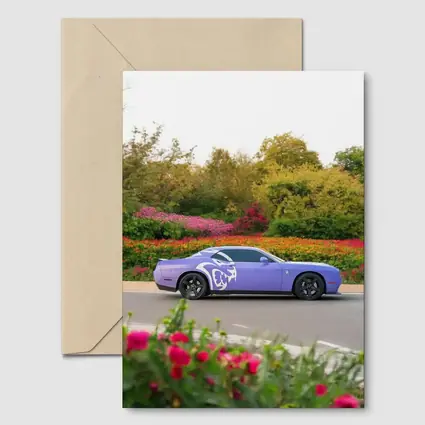Purple Dodge Challenger Parked Near Flowers