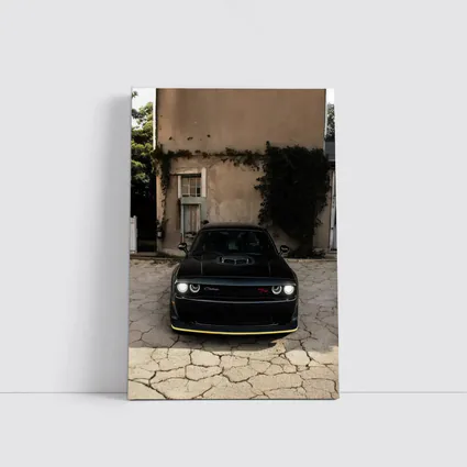Black Dodge Challenger Parked Before Old House