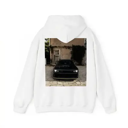 Black Dodge Challenger Parked Before Old House