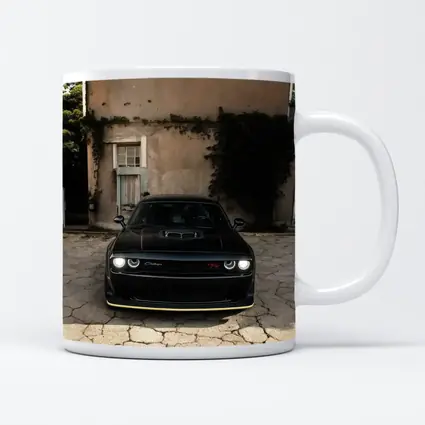Black Dodge Challenger Parked Before Old House