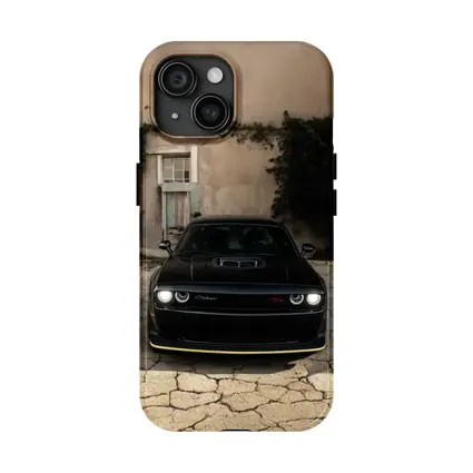 Black Dodge Challenger Parked Before Old House