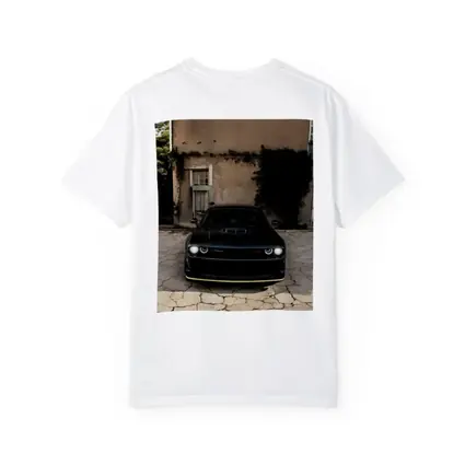 Black Dodge Challenger Parked Before Old House