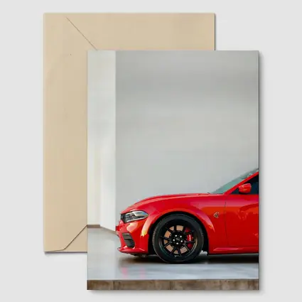 Red Dodge Charger Parked in Garage