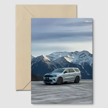 Dodge Durango Silver SUV Snowy Mountain Backdrop