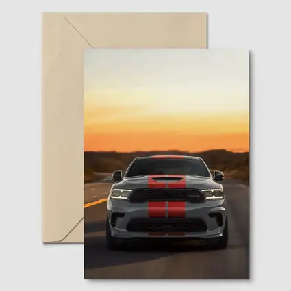 Dodge Durango Racing Down Road At Sunset