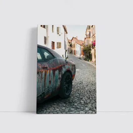 Rusty Dodge Challenger on Cobblestone Street