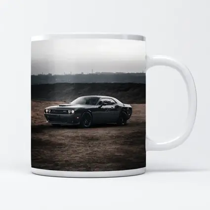 Black Dodge Challenger Parked on Dirt Ground