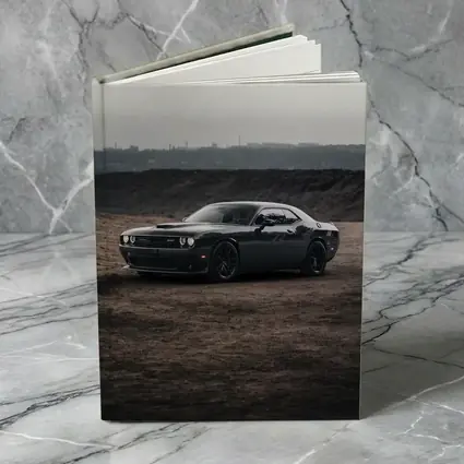 Black Dodge Challenger Parked on Dirt Ground