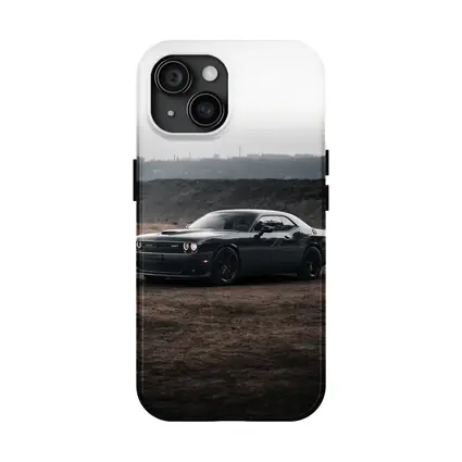 Black Dodge Challenger Parked on Dirt Ground