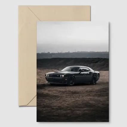 Black Dodge Challenger Parked on Dirt Ground