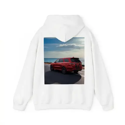 Red Dodge Durango Driving Along Coastal Road