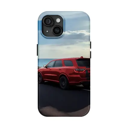 Red Dodge Durango Driving Along Coastal Road