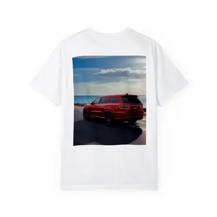 Red Dodge Durango Driving Along Coastal Road