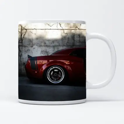 Red Dodge Challenger Parked Against Concrete Wall