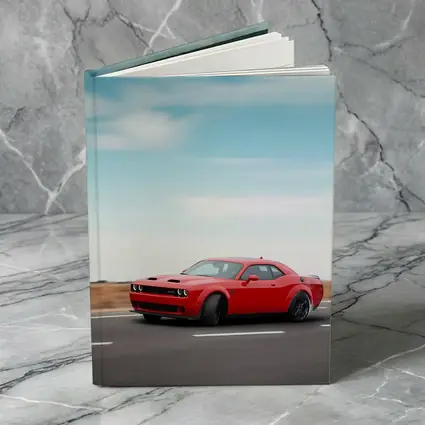Red Dodge Challenger Speeding On Open Road