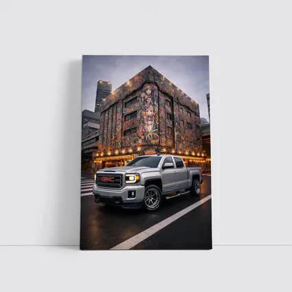 GMC Sierra Truck Parked Near Mural Building