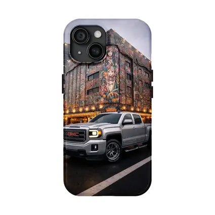GMC Sierra Truck Parked Near Mural Building
