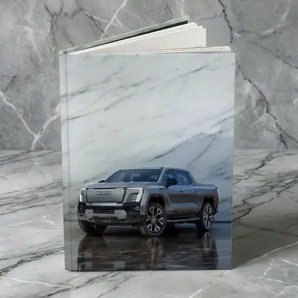 GMC Sierra EV Against Marble Wall