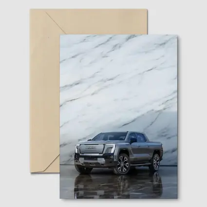 GMC Sierra EV Against Marble Wall