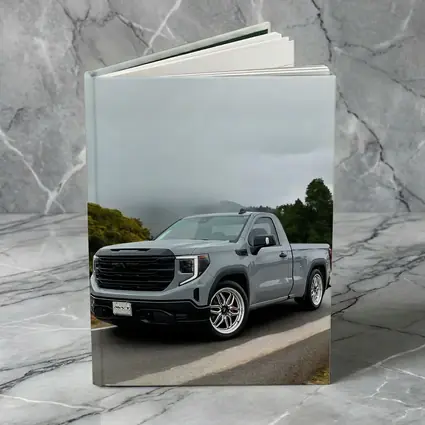GMC Sierra Truck on Misty Mountain Road