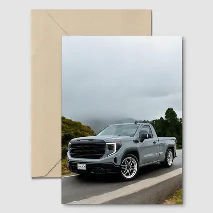 GMC Sierra Truck on Misty Mountain Road